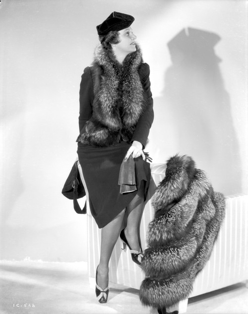 Irene Castle sitting on a Stripe Chair with Furry Coat Photo Print - Item # VARCEL695906