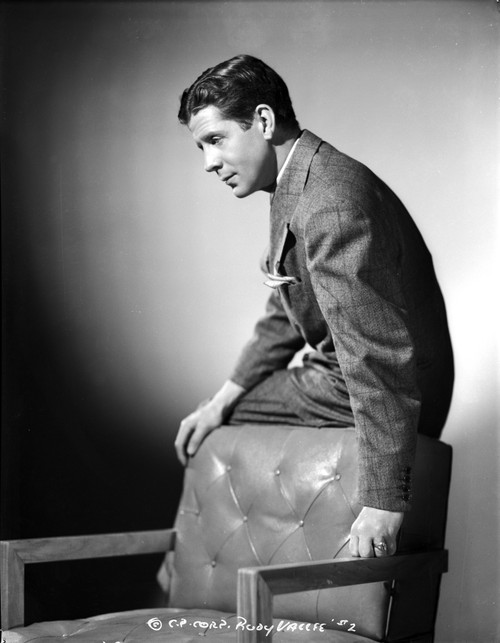 A Portrait Of Rudy Vallee Leaning on A Chair Photo Print - Item # VARCEL695901