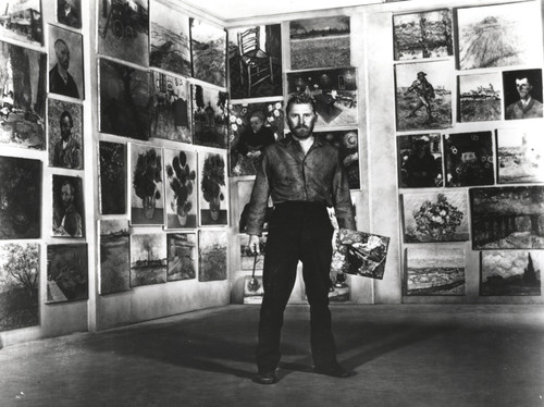 Kirk Douglas with his Photos Black and White Photo Print - Item # VARCEL696025