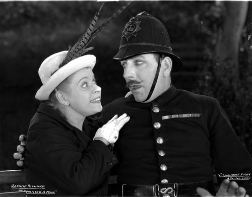 Daphne Pollard on a Hat and smiling to a Man Photo Print - Item # VARCEL703148