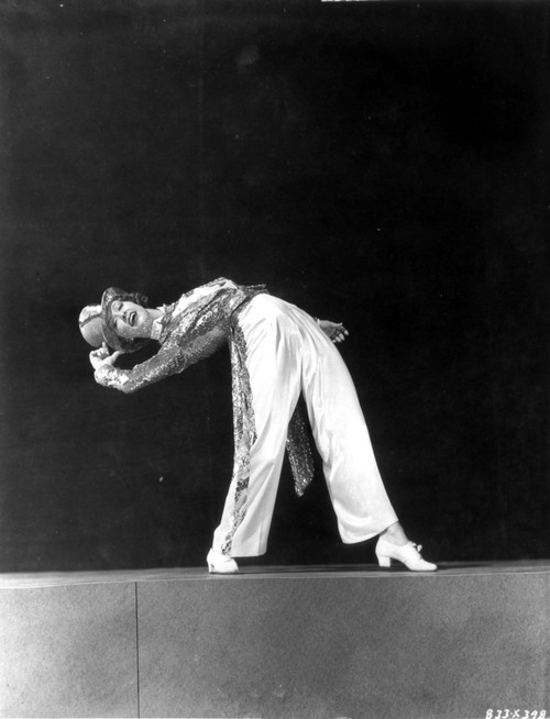 Eleanor Powell Bending Backward with Hat Pose Photo Print - Item # VARCEL703203