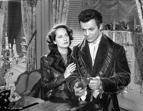 Song To Remember Woman Holding on a Man's Arms in a Movie Scene Photo Print - Item # VARCEL703247