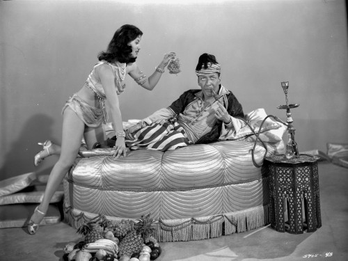 Looking For Danger Man Lying on bed and Lady Offering a Grapes Photo Print - Item # VARCEL703299
