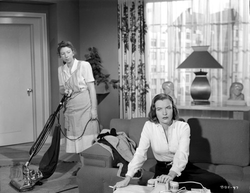 Ella Raines sitting and Smoking Movie Scene Photo Print - Item # VARCEL703379