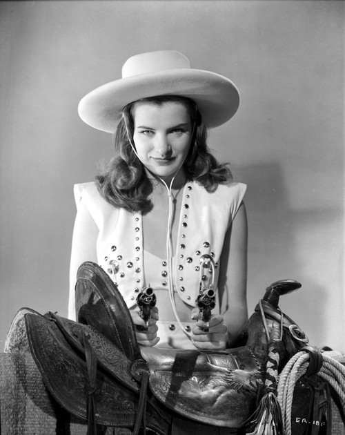 Ella Raines Seated in Cowgirl Attire Photo Print - Item # VARCEL703409