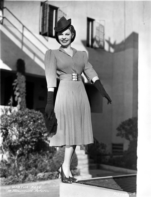 Martha Raye on a Dress standing and smiling Photo Print - Item # VARCEL703521