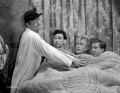 Smuggler's Cove Three Men Lying on the Bed in a Movie Scene Photo Print - Item # VARCEL703512