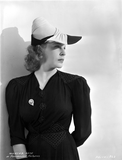 Martha Raye Leaning on the Wall wearing Black Coat Photo Print - Item # VARCEL703515