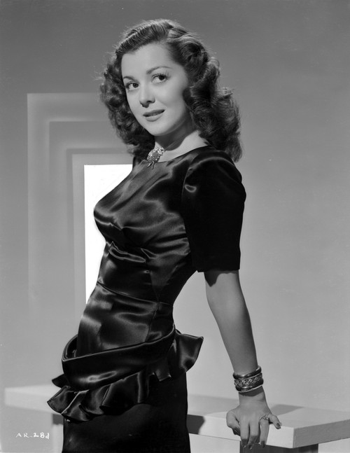 Ann Rutherford Holding on the Table, wearing a Black Dress Photo Print - Item # VARCEL704066