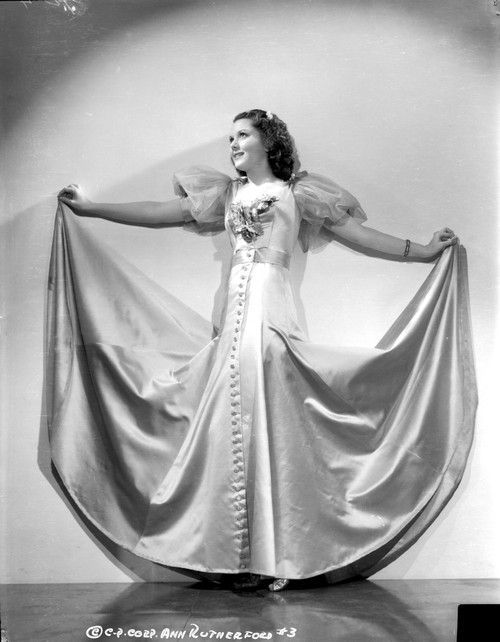 Ann Rutherford Looking Away, Spreading Her Long Skirt Photo Print - Item # VARCEL704068
