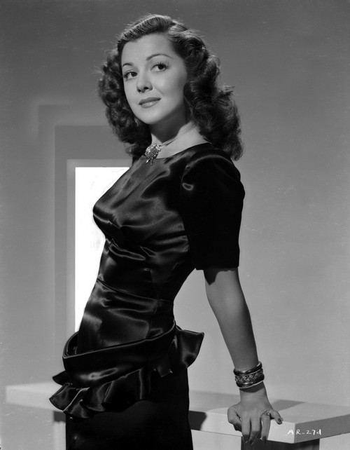 Ann Rutherford Leaning on a Table, Making a Cute Smile Photo Print - Item # VARCEL704098