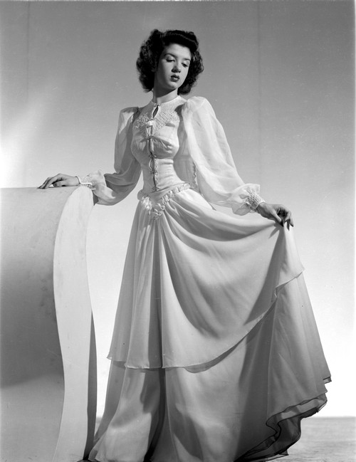 Peggy Ryan standing wearing White Elegant Gown Portrait Photo Print - Item # VARCEL704110