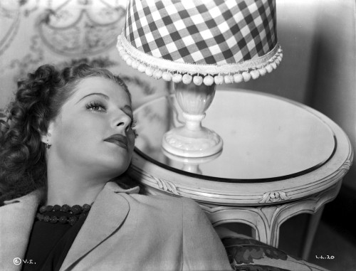 Ann Sheridan Leaning on the Chair Near a Lamp Shade Photo Print - Item # VARCEL704373