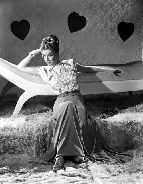 Ann Sheridan sitting on the Floor while Leaning on the Chair Photo Print - Item # VARCEL704384