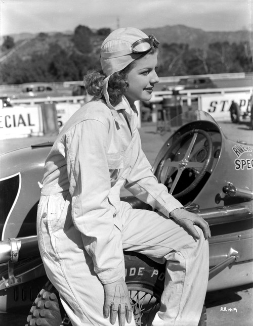 Ann Sheridan sitting on a Racing Car Photo Print - Item # VARCEL704416