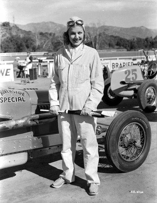 Ann Sheridan standing Next to a Race Car Photo Print - Item # VARCEL704420