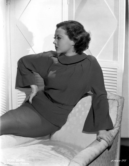 Sylvia Sidney Reclining on a Couch in Long Sleeve Blouse Photo Print - Item # VARCEL704497