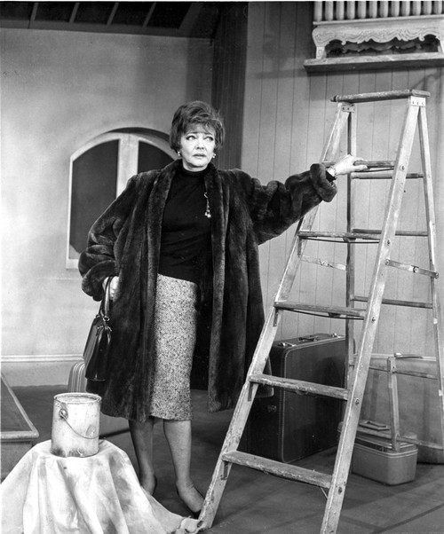 Sylvia Sidney Posed in a Furry Black Coat with a Steel Ladder Photo Print - Item # VARCEL704556