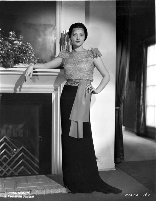 Sylvia Sidney posed Beside the Fireplace and Hand on Waist Photo Print - Item # VARCEL704558
