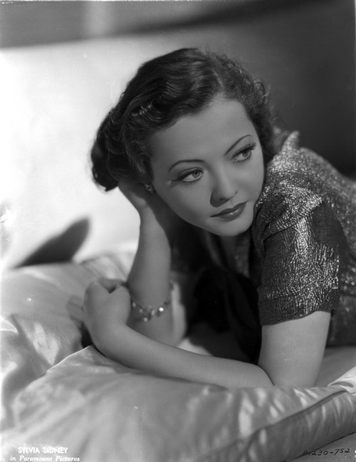 Sylvia Sidney Lying on a Silk Beddings in Shiny Blouse Photo Print - Item # VARCEL704535