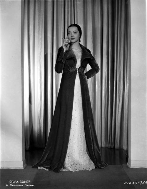 Sylvia Sidney wearing and Smoking in Gown Photo Print - Item # VARCEL704567