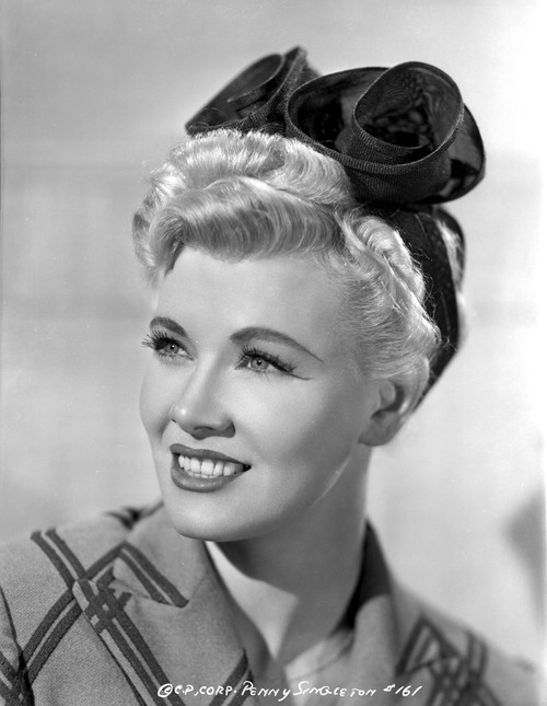 Penny Singleton smiling wearing Flower Head Band Close Up Portrait Photo Print - Item # VARCEL704589