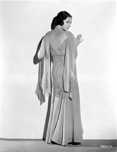 Sylvia Sidney Leaning on a White Wall in Gown Photo Print - Item # VARCEL704562