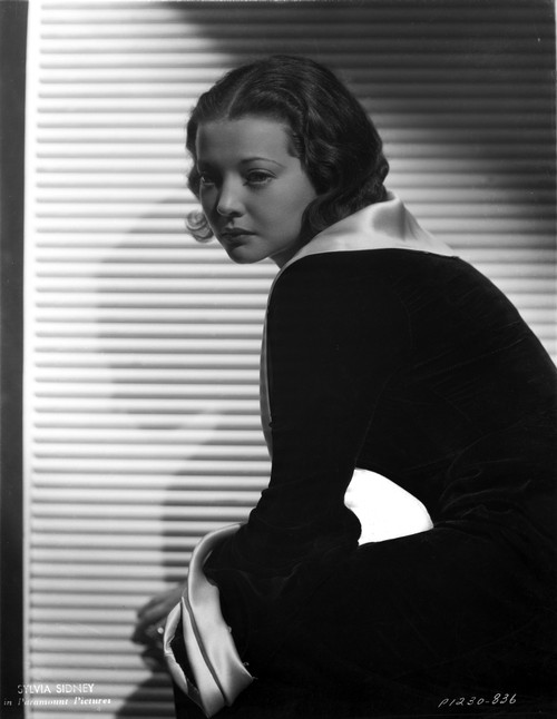 Sylvia Sidney sitting and posed in Black Dress Photo Print