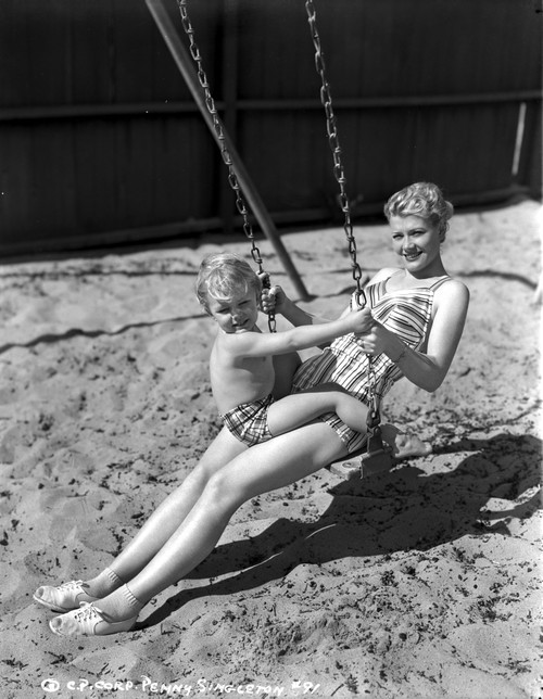Penny Singleton Swing Riding with Son at the Beach Photo Print - Item # VARCEL704619
