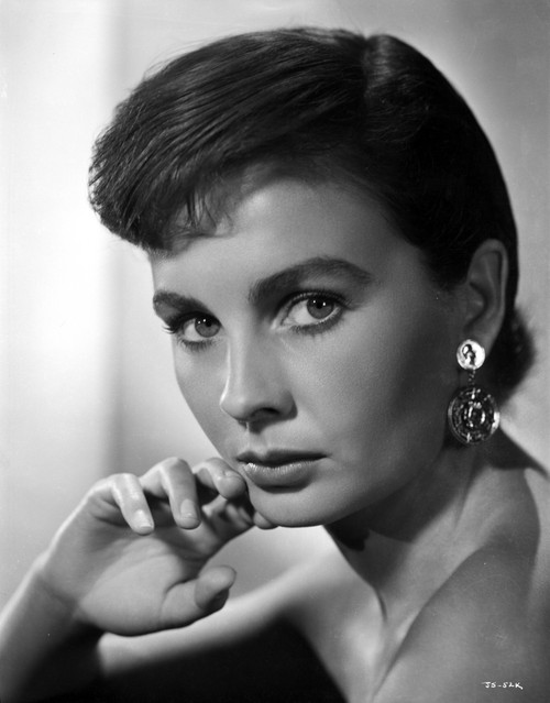 Jean Simmons Portrait in Black Off Shoulder Dress and Coin Earrings with Right Hand on the Chin Photo Print - Item # VARCEL704689