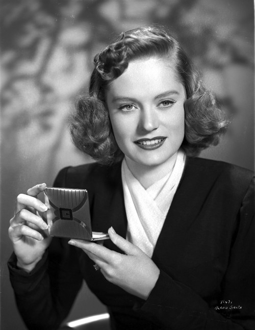 Alexis Smith Putting a Make Up While smiling Photo Print - Item # VARCEL704772