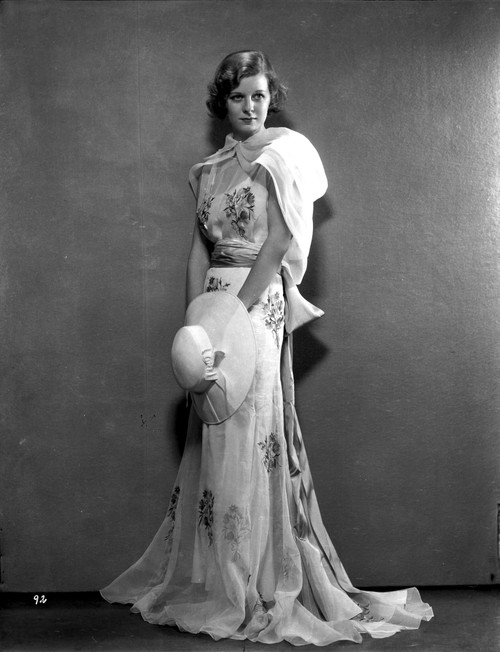Margaret Sullivan standing in White Gown with Hat Photo Print - Item # VARCEL704922