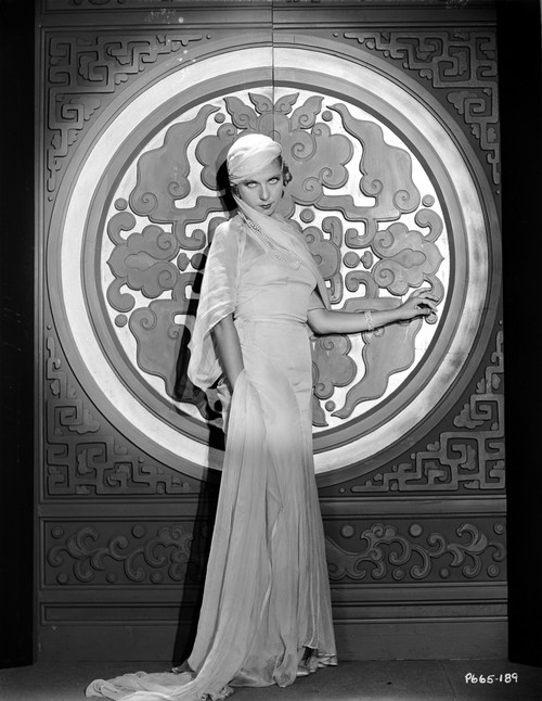 Lilyan Tashman Posed in Long Gown and Cap Photo Print - Item # VARCEL705008