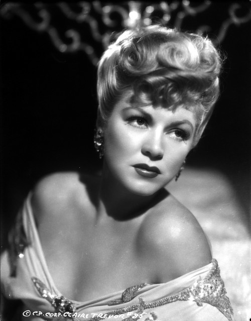 Claire Trevor Looking Away in Floral Dress with Earrings Photo Print - Item # VARCEL705215