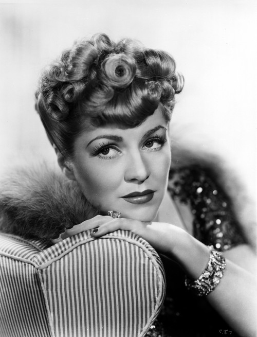 Claire Trevor Head Leaning on Couch with Fur Coat Photo Print - Item # VARCEL705251