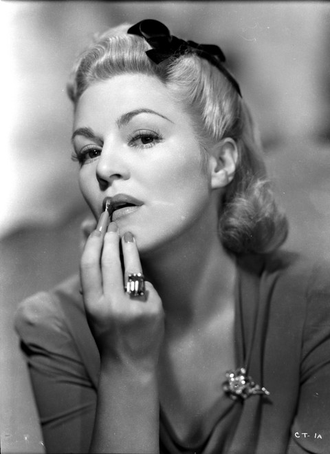 Claire Trevor Putting lipstick in Dress with Ring Photo Print - Item # VARCEL705257
