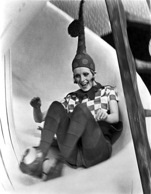 A portrait of Twiggy on a slide in an elf costume Photo Print - Item # VARCEL705314