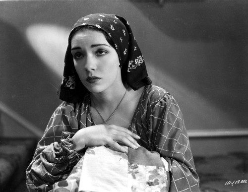 Lupe Velez Posed in Checkered Dress with Black Scarf on Her Head Photo Print - Item # VARCEL705359