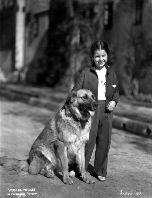 Virginia Weidler standing with Dog Photo Print - Item # VARCEL705435
