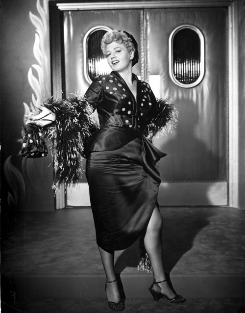 Shelley Winters Posed in Black Dress with Sarong Skirt and Fur Boa Photo Print - Item # VARCEL705544