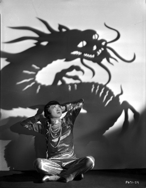 Anna Wong sitting on the Floor with Dragon Background Photo Print - Item # VARCEL705641
