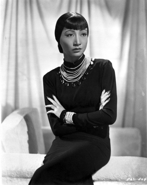 Anna Wong sitting on the Couch, Arms Crossed Photo Print - Item # VARCEL705702