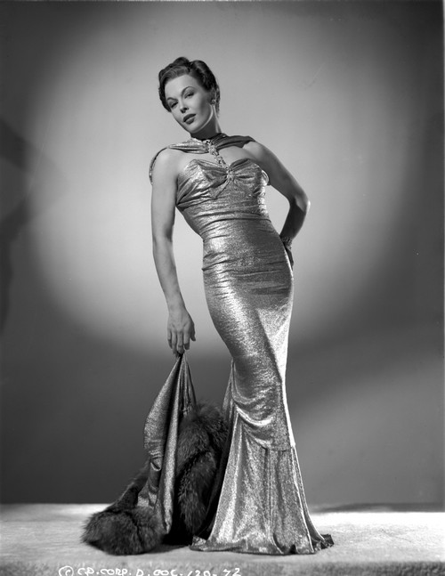 Joan Woodbury bending Backwards, wearing a Long Glossy Gown Photo Print - Item # VARCEL705729