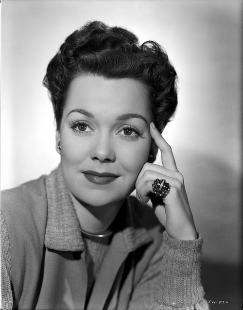 Jane Wyman Portrait in Gery Linen Tweed Coat and Grey Shirt with Head Leaning on the Left Hand Photo Print - Item # VARCEL705836