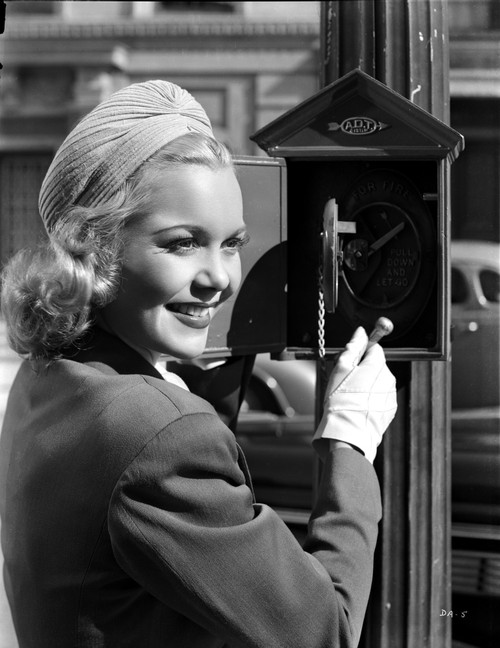 Jane Wyman Posed in Black Velvet Long Sleeve Suit Dress and White Hat Photo Print - Item # VARCEL705866
