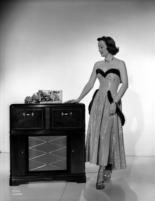 Jane Wyman Posed in White Silk Strapless Dress with Black Fur Belt Around and Below the Waist Photo Print - Item # VARCEL705874