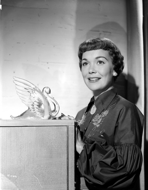 Jane Wyman Posed in Black Velvet Pleated Long Sleeve Dress and Pearl Earrings with Right Hand on the Cabinet Photo Print