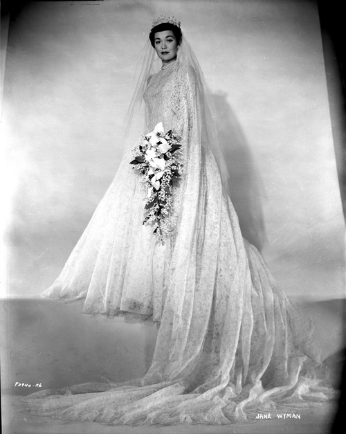 Jane Wyman Posed in White Silk Long Sleeve Wedding Dress and Long Sheer Veil Photo Print - Item # VARCEL705894
