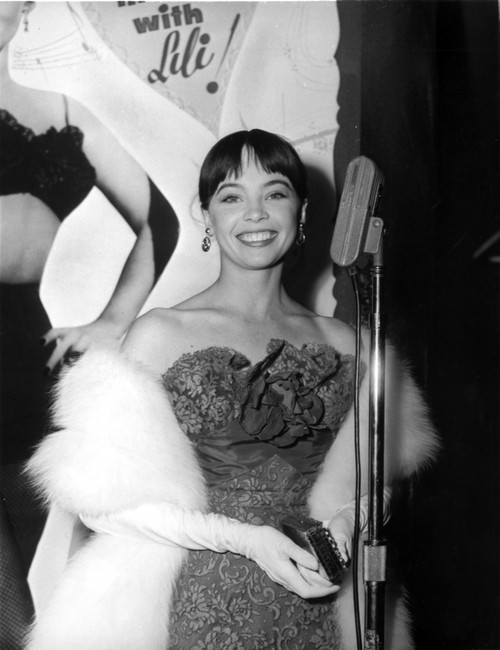 Leslie Caron Smiles wearing Elegant Gown with Fur Coat Photo Print - Item # VARCEL706064