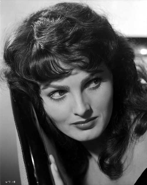 Ursula Theiss laying her head against a chair back, looking away from the camera Photo Print - Item # VARCEL706363